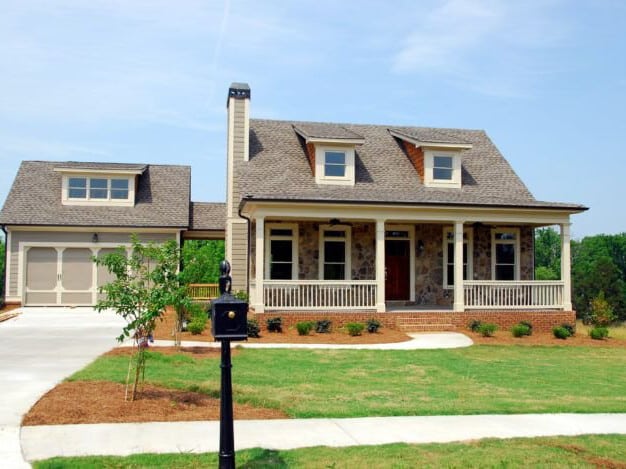 Cozy home setting depicting the process of finding the right realtor, highlighting a person reviewing listings and meeting with a real estate agent, emphasizing the importance of personalized service in home buying.