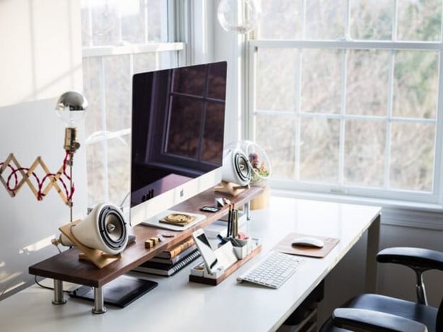 Neatly organized home office space featuring efficient storage solutions, including shelves, filing cabinets, and desktop organizers, creating a productive and clutter-free work environment.