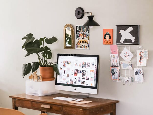 Practical tips to achieve a minimalistic home office, including decluttering workspaces, utilizing multifunctional furniture, implementing organized storage solutions, and creating a calming color palette to enhance focus and productivity.