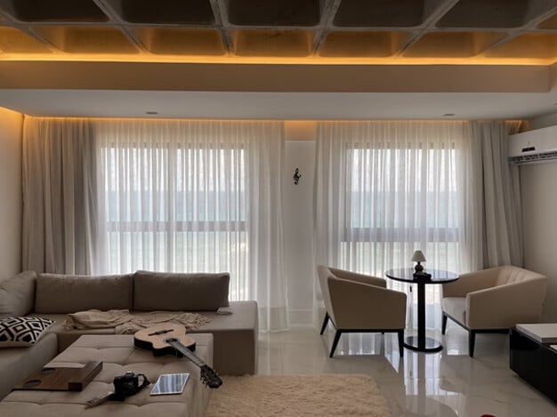 Stylishly designed studio apartment showcasing various layout options, including multifunctional furniture and creative space-saving solutions, illustrating how to maximize functionality and aesthetics in a compact living area