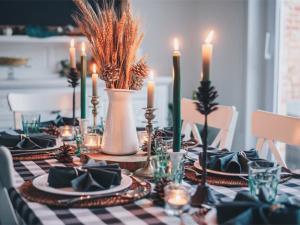 Warm and inviting cozy fall aesthetics at home, featuring plush blankets, decorative pumpkins, warm-toned candles, and seasonal decor that create a snug atmosphere perfect for enjoying the autumn season.