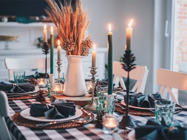 Warm and inviting cozy fall aesthetics at home, featuring plush blankets, decorative pumpkins, warm-toned candles, and seasonal decor that create a snug atmosphere perfect for enjoying the autumn season.