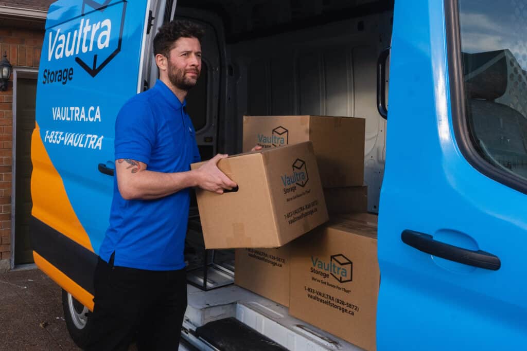 A Vaultra Storage representative helping move your items into your storage units.