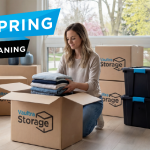 Person packing boxes at home with Vaultra Storage boxes during spring cleaning