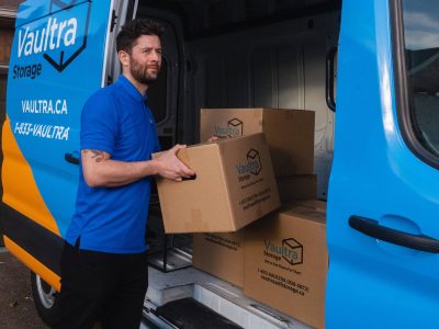 A Vaultra Storage representative helping move your items into your storage units.